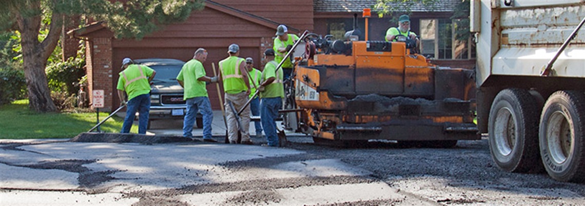 Public works department members fixing road