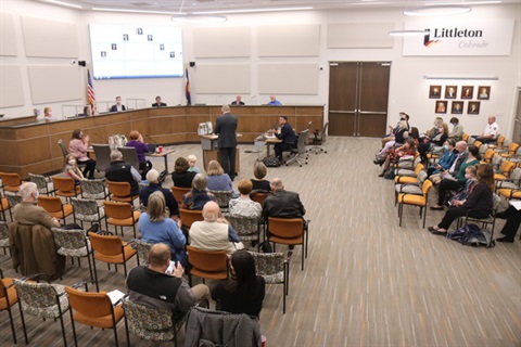 People attending a City Council meeting
