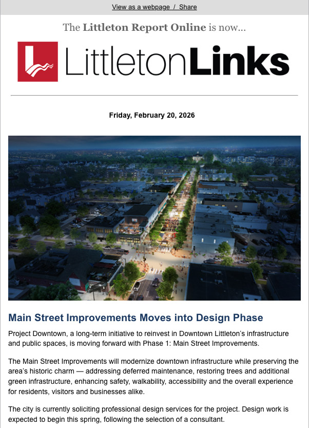 Aerial view of downtown street with cars, people, and shops, featured in a city newsletter.