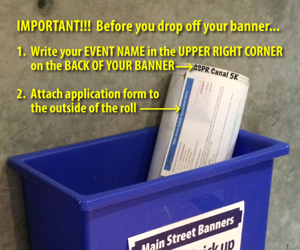 Blue bucket with banner rolled up and place inside. Banner has event name printed on back of banner in the upper right corner.