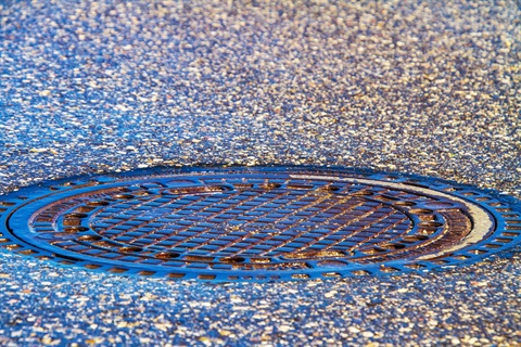 manhole cover in road