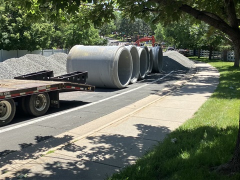 Concrete pipes lined up and ready to install.