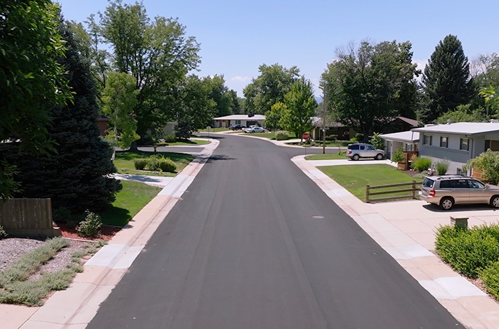 Aerial view of street that has recently been slurry-sealed.