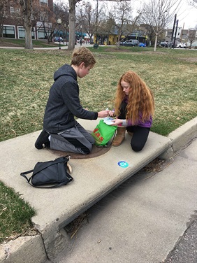 Two people marking an inlet